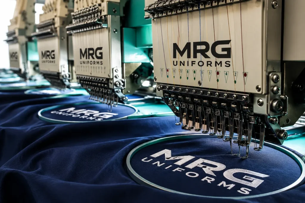 Logo embroidery on corporate uniforms at MRG Uniforms Ajman factory